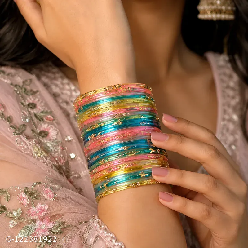 These Shevibe transparent multicolor glass bangles feature gold dotted details.