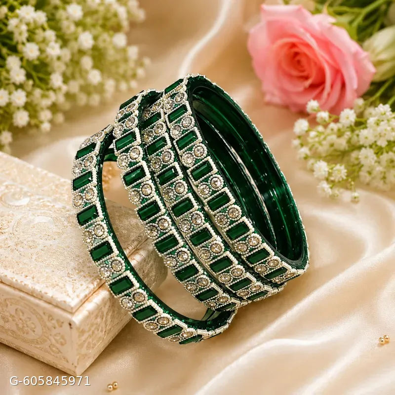 These green bangle sets feature gold-toned detailing and sparkling stone accents, perfect for adding a traditional touch to festive or bridal attire.