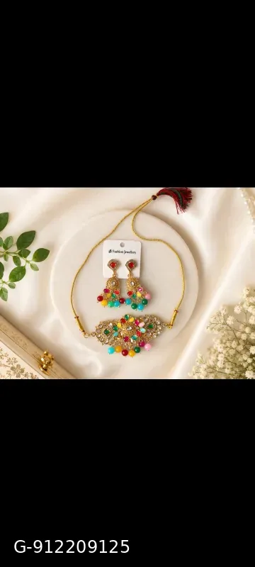 This gold-plated Kundan choker set features multicolored beads and artificial stones, resembling traditional Indian bridal jewelry